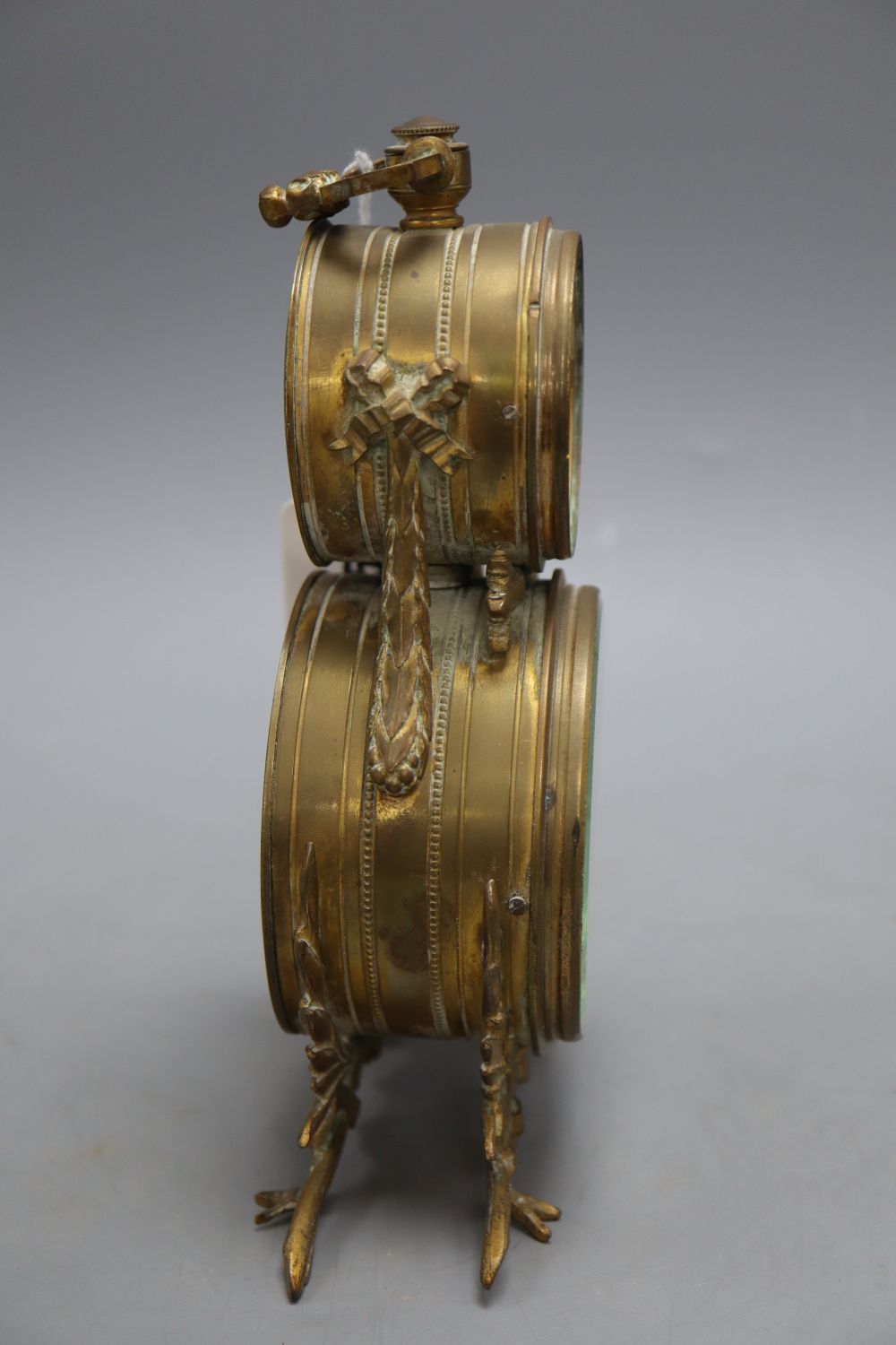 An ormolu desk timepiece and aneroid barometer, height 21cm